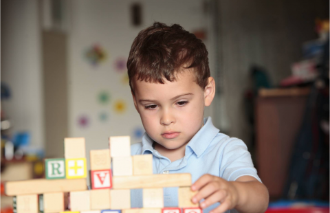 child playing with blocks