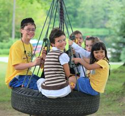 children on tire swing