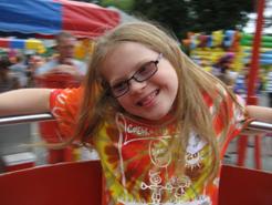 Girl with down syndrome at amusement park