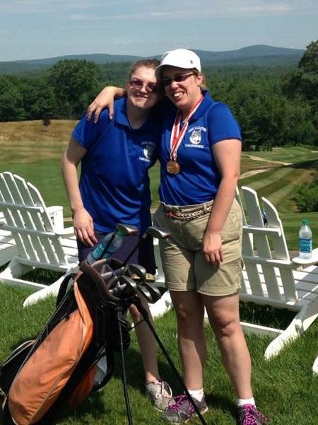 People golfing