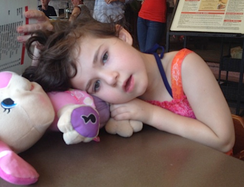 Young girl with bunny stuffed animal