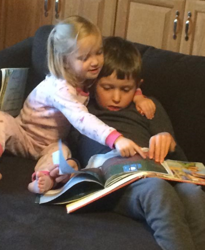Liam and his sister reading