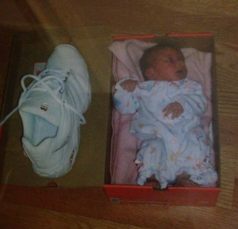 Baby Susanne next to a shoe