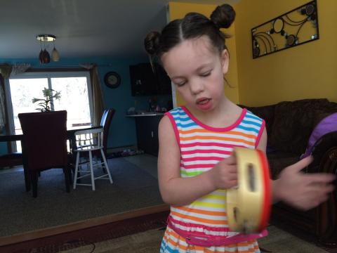 Zhala playing the tamborine